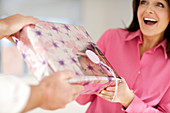 Woman recieving a gift