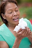 Woman sneezing