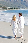 Couple walking along a beach