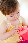 Toddler with training cup