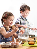 Young children baking