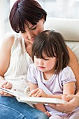 Mother and daughter reading