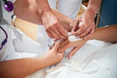 Nurse preparing a patient for an IV line