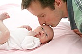 Father and two week old daughter