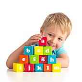 Boy playing with alphabet blocks