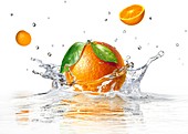 Orange splashing into water,artwork