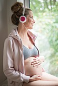 Pregnant woman listening to music