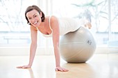 Woman on exercise ball