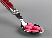 Spoon and pills