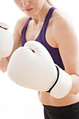 Woman wearing boxing gloves