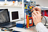 Person repairing electronic circuit board