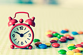 Alarm clock and confectionary