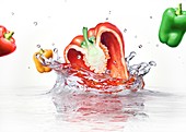 Peppers splashing into water,artwork