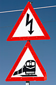 Railway crossing and electricity signs