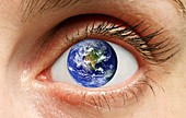 Human eye with planet earth