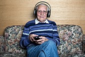 Senior man wearing headphones
