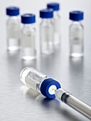 Vaccine vials and syringe