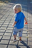 Boy walking on path