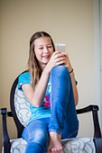 Teenage girl using smartphone