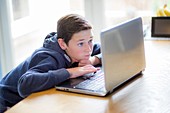 Boy using a laptop