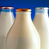 Tops of three types of bottled milk