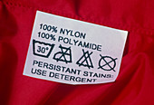Washing instructions on label on nylon clothing