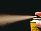 Close-up of aerosol spray in action