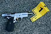 Gun and marker at a crime scene