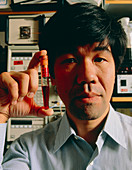 Dr K.Nagai with tube of haemoglobin blood sub'ute