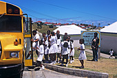 Schoolchildren boarding a bus