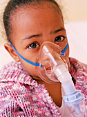 Girl with asthma nebulizer