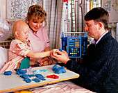 Child with Ewing's sarcoma playing in an hospital