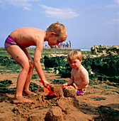 A child with Down's syndrome playing with a friend