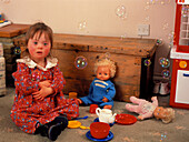 3-year-old girl with Down's syndrome with bubbles