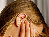 Woman suffering from earache