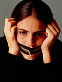 Anorexia nervosa: girl with zip around her mouth