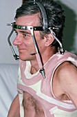 Man wearing a neck brace after a spinal fracture
