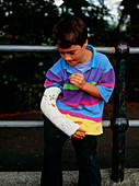 Young boy with the right arm in plaster