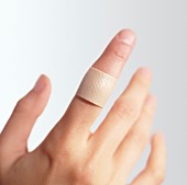 Sticking plaster on a finger