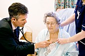 GP visiting elderly patient