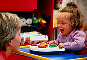 Cerebral palsy child with occupational therapist