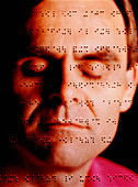 Blind man's face on a sheet written in braille