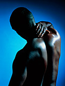 Neck/shoulder pain: black man with hand on neck