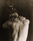 Woman holding her neck due to pain