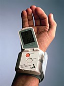 Portable pulse meter on a man's wrist