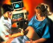 Ultrasound scanning of a pregnant woman's abdomen