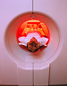 Female patient undergoing an upper-body CT scan