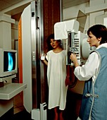 Woman undergoing barium meal x-ray examination