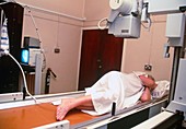 Woman undergoing a barium enema X-ray examination