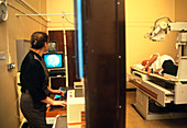 Man undergoing an abdominal X-ray examination
